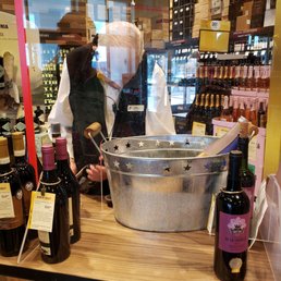a man pouring wine into a bucket a man pouring wine into a bucket