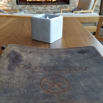 OUTLAW Taproom - Sitting area surrounding fireplace ... - Cocktail Bars Near Me - Irving, Texas