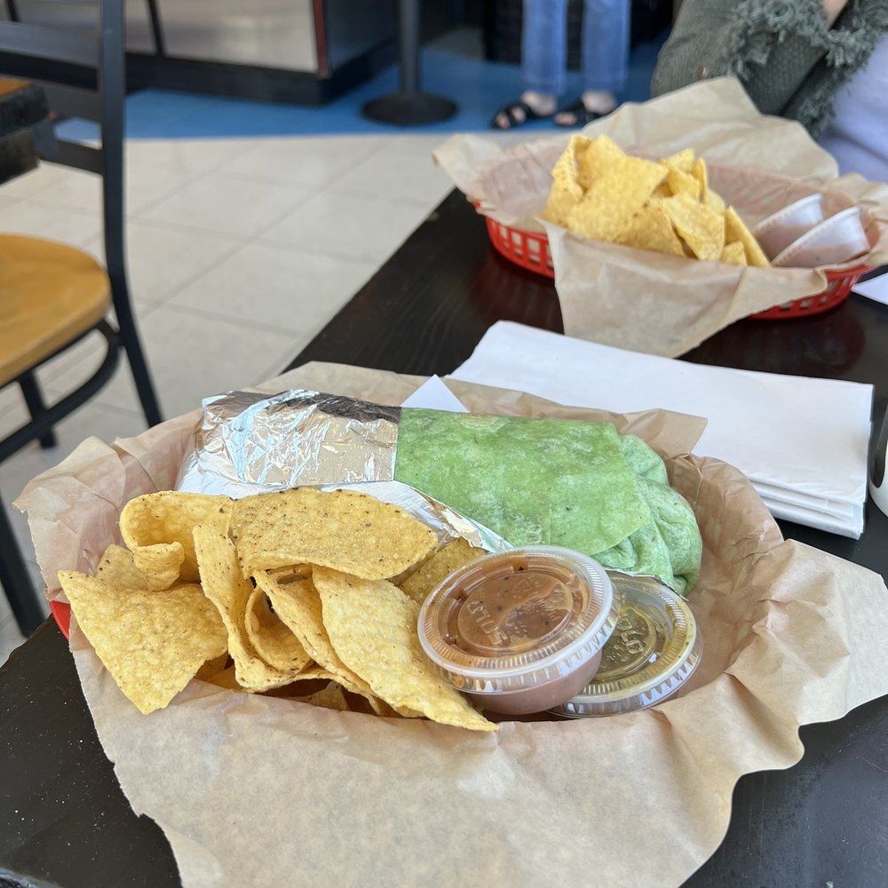 360 Gourmet Burritos - a woman sitting at a table - Mexican Near Me - Lafayette, California