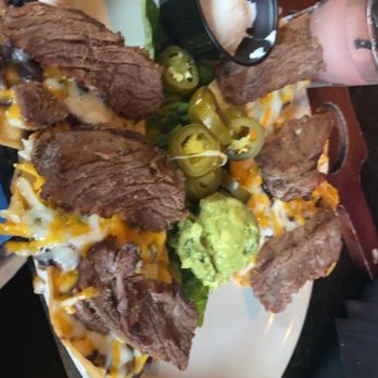 Rio Mambo - The 1/2 order of beef fajita nachos. Check review for details - Tex-Mex Near Me - Fort Worth, Texas Rio Mambo - The 1/2 order of beef fajita nachos. Check review for details - Tex-Mex Near Me - Fort Worth, Texas