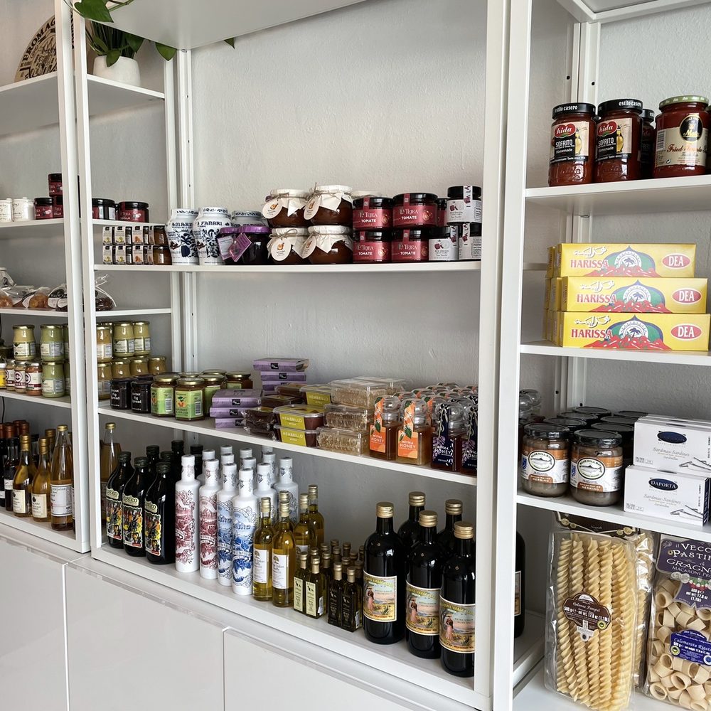Oh La Vache - a shelf full of food and condiments - Cheese Shops Near Me - Long Beach, California