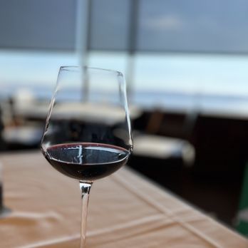 Cutters Crabhouse - a glass of wine on a table - Seafood Near Me - Seattle, Washington