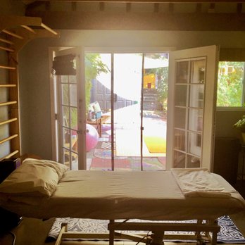 Be Well Therapy - The treatment table is close to the French door for ample ventilation. There is a mosquito net to prevent insects from getting inside. - Physical Therapy Near Me Be Well Therapy - The treatment table is close to the French door for ample ventilation. There is a mosquito net to prevent insects from getting inside. - Physical Therapy Near Me