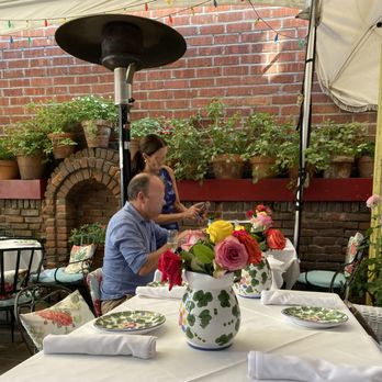 The Ivy - Every table sports beautiful crockery and fresh flowers. Ivy in pots against the brick wall. The atmosphere is fresh and floral. - New American Near Me - Los Angeles, California The Ivy - Every table sports beautiful crockery and fresh flowers. Ivy in pots against the brick wall. The atmosphere is fresh and floral. - New American Near Me - Los Angeles, California
