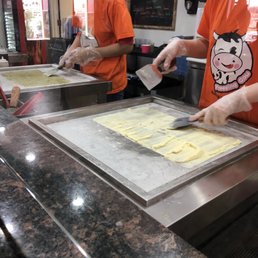 Preparing the liquid ice cream on the cold slab Preparing the liquid ice cream on the cold slab