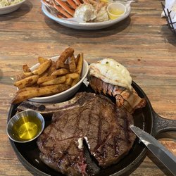 Harborside - Ribeye steak with a side of lobster tail and snow crab legs