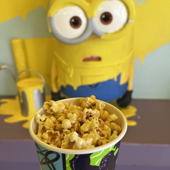 Pop-A-Nana - ows a cup of popcorn with a minion in the background - Popcorn Shops Near Me - Orlando, Florida Pop-A-Nana - ows a cup of popcorn with a minion in the background - Popcorn Shops Near Me - Orlando, Florida