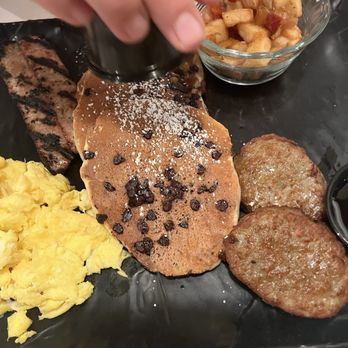 Black Walnut Café - BIG PLATE with chocolate chip pancakes - New American Near Me - Houston, Texas