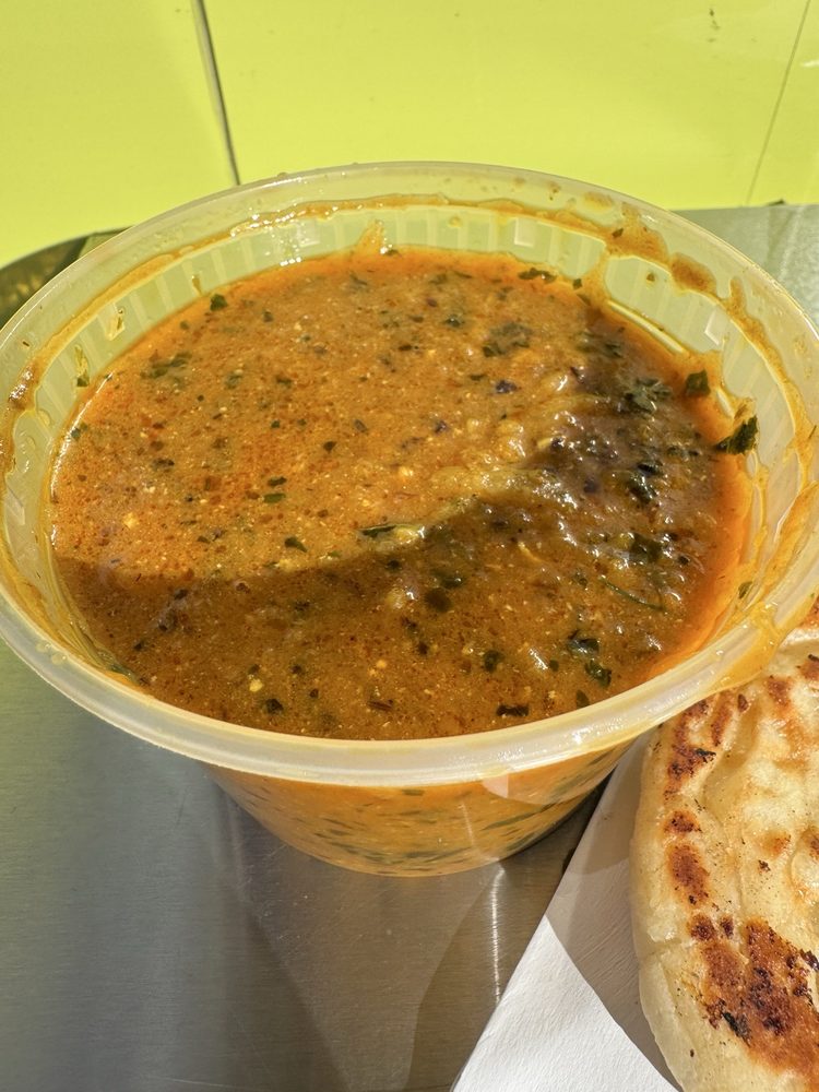 Naan Stop Curry Logo