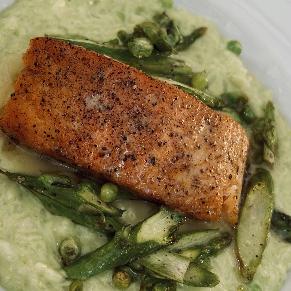 Joseph Decuis - Perfectly cooked salmon with lemon caper butter sauce and the best spring pea risotto you'll ever have! - New American Near Me - Roanoke, Indiana Joseph Decuis - Perfectly cooked salmon with lemon caper butter sauce and the best spring pea risotto you'll ever have! - New American Near Me - Roanoke, Indiana