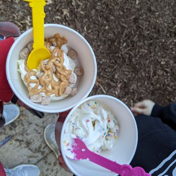 Menchie's Frogen Yogurt - a man holding two cups of yogurt - Ice Cream & Frozen Yogurt Near Me - Foxboro, Massachusetts Menchie's Frogen Yogurt - a man holding two cups of yogurt - Ice Cream & Frozen Yogurt Near Me - Foxboro, Massachusetts