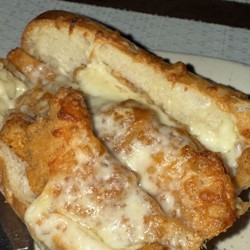 Greg's Tavern - Chicken fingers, Mozzarella Sticks and French Fry sandwich with marinara sauce. - Pizza Near Me - Beverly, Massachusetts Greg's Tavern - Chicken fingers, Mozzarella Sticks and French Fry sandwich with marinara sauce. - Pizza Near Me - Beverly, Massachusetts