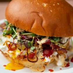 Gunther’s - The Kithy! Two fried eggs, ricotta, crispy shallots, micro greens, tamari ginger aioli on brioche. We like to add bacon to ours!