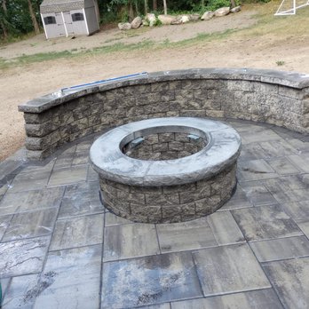 CM Landscaping Services - a stone fire pit - Landscaping Near Me