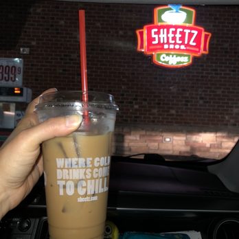 Sheetz - a person holding a cup of coffee - Gas Stations Near Me - Chardon, Ohio