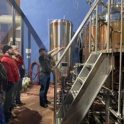 City Brew Tours Pittsburgh - Our Brew Tour Guide, Kevin, pointing out the tanks in the brew process at Church Brew Works.