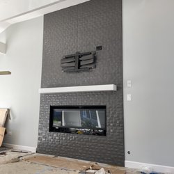 AK Forever - laying tiles on a fire place