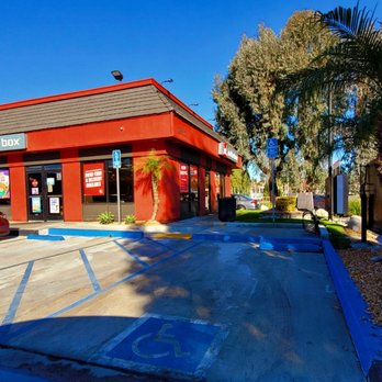 Jack in the Box - a parking lot with a red building - Fast Food Near Me - Chino Hills, California
