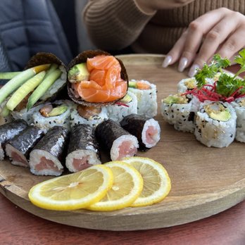 Takumi Sushi - a plate of food on a table - Japanese Near Me - Montreal, Quebec Takumi Sushi - a plate of food on a table - Japanese Near Me - Montreal, Quebec