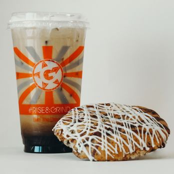 On The Grind - a frosted donut next to a cup of coffee - Coffee & Tea Near Me - Seguin, Texas On The Grind - a frosted donut next to a cup of coffee - Coffee & Tea Near Me - Seguin, Texas