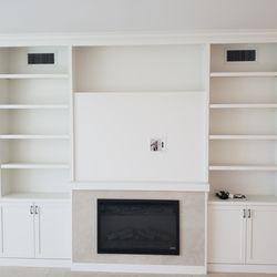 StyleCraft Cabinetry and Construction - Custom Entertainment Center built with 3/4" plywood with painted maple veneer.