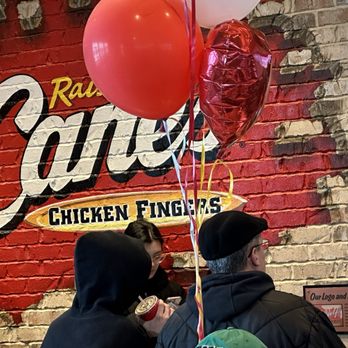 Raising Cane's Chicken Fingers - people standing in front of a brick wall - Fast Food Near Me - Marlton, New Jersey Raising Cane's Chicken Fingers - people standing in front of a brick wall - Fast Food Near Me - Marlton, New Jersey