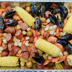 Harbor House Seafood Market - Seafood boil with shrimp, mussels, bay scallops, sausage, corn, and potatoes