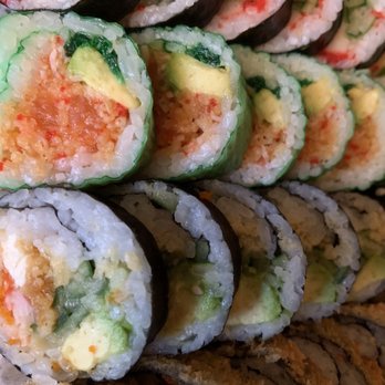 Top Sushi - a stack of sushi rolls - Asian Fusion Near Me - Laval, Quebec