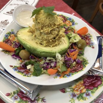 The Tasting Room Cafe - Chicken curry salad stuffed in an avocado half - Tea Rooms Near Me - Laredo, Texas The Tasting Room Cafe - Chicken curry salad stuffed in an avocado half - Tea Rooms Near Me - Laredo, Texas
