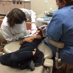 Nancy Nga Luu, DDS - Filling time!  No, my daughter isn't writhing in pain, she is comfortable sitting like this.  I sit weird too sometimes.