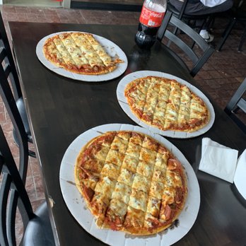 Old Plank Pizza - three pizzas on a table - Pizza Near Me - Frankfort, Illinois Old Plank Pizza - three pizzas on a table - Pizza Near Me - Frankfort, Illinois