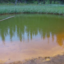 Paint Pots with mineral deposits with green reflection