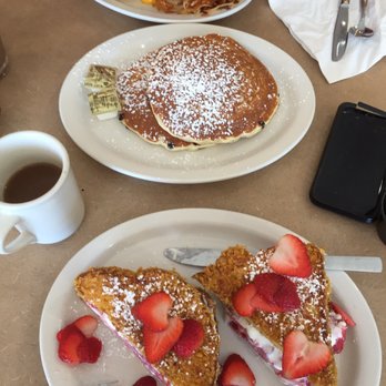Kristof's Kafe - Strawberry French toast, chocolate chip pancakes, and breakfast sandwich on a croissant - American Near Me - Davie, Florida