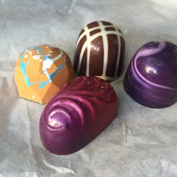 Matthew's Chocolates - Truffles: orange (coconut), brown with white stripes (Creme brulee), purple (lavender), pink purple (passion fruit) - Desserts Near Me - Hillsborough, North Carolina Matthew's Chocolates - Truffles: orange (coconut), brown with white stripes (Creme brulee), purple (lavender), pink purple (passion fruit) - Desserts Near Me - Hillsborough, North Carolina