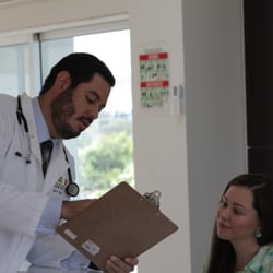 Regenerative Medicine Institute - Regenerative Medicine Institute doctor discussing a patient with the receptionist.