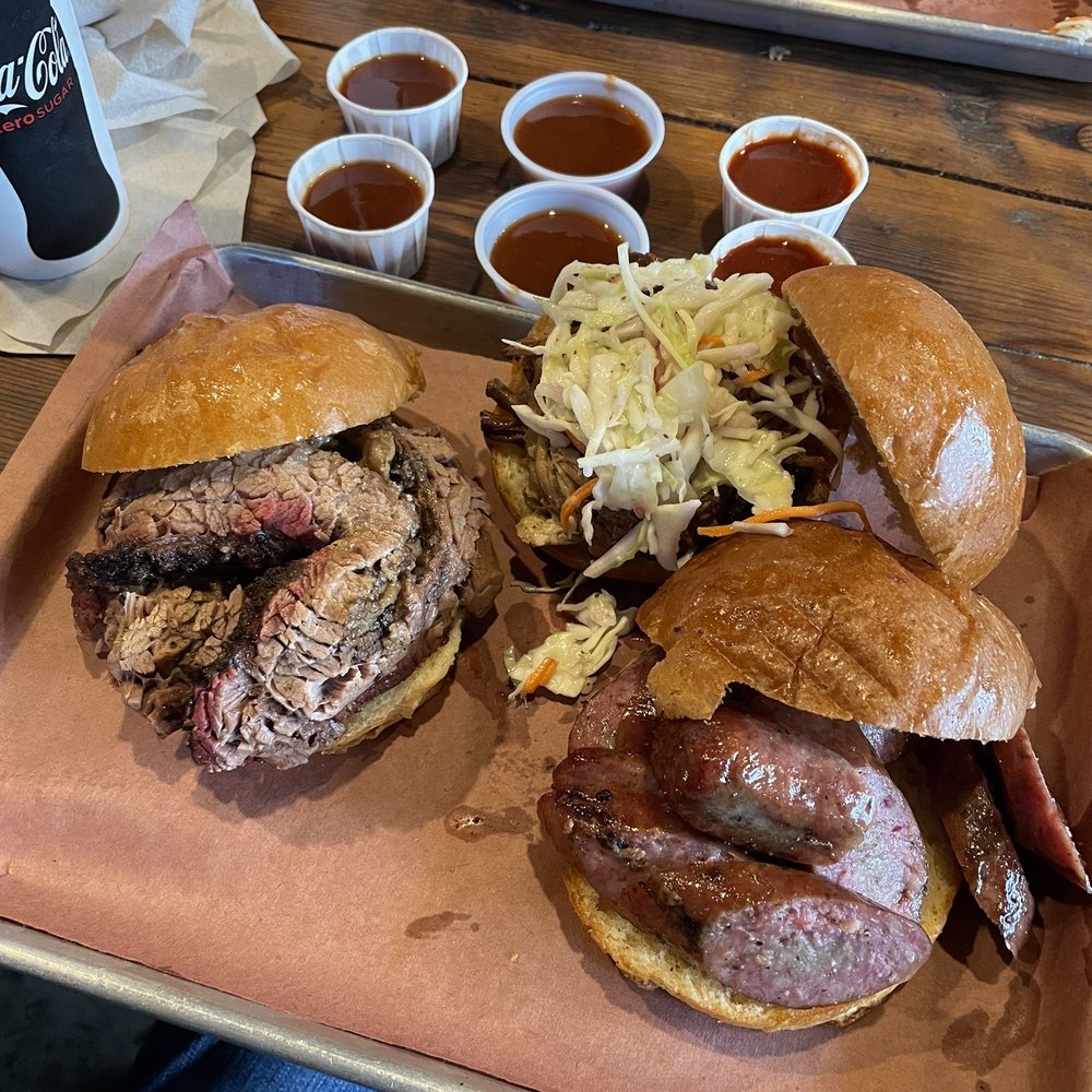 HammerDown BBQ - Sliced brisket sandwich, pulled pork sandwich and sausage sandwich with sauces. - Barbeque Near Me - Aldie, Virginia