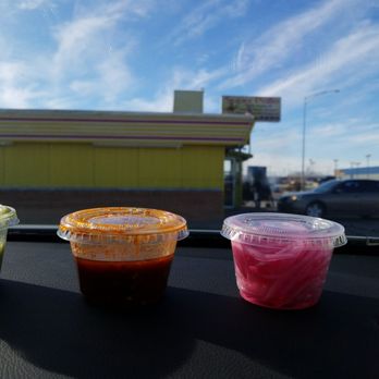 Super Pollo - three cups of sauce on the dashboard of a car - Mexican Near Me - Liberal, Kansas