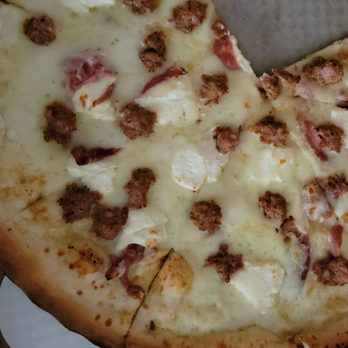 Andolini's Pizzeria Owasso - S.P.Q.R. Pizza (Ricotta, garlic, house-made Italian sausage, prosciutto.) - Pizza Near Me - Owasso, Oklahoma Andolini's Pizzeria Owasso - S.P.Q.R. Pizza (Ricotta, garlic, house-made Italian sausage, prosciutto.) - Pizza Near Me - Owasso, Oklahoma