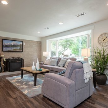 Lux Renovations - a living room with hardwood floors and a fireplace - General Contractors Near Me Lux Renovations - a living room with hardwood floors and a fireplace - General Contractors Near Me