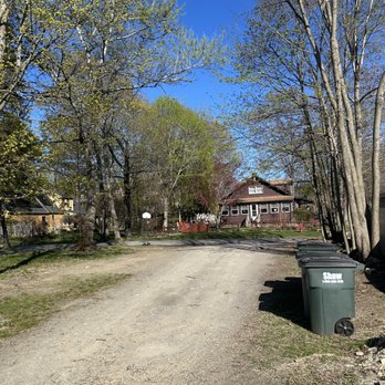 HM Flagg Tree Service - Our yard to the left. Tree stump by the barrels. - Tree Services Near Me - Ayer, Massachusetts HM Flagg Tree Service - Our yard to the left. Tree stump by the barrels. - Tree Services Near Me - Ayer, Massachusetts