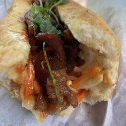 Inside sauce, jicama, carrots, cilantro and BBQ pork