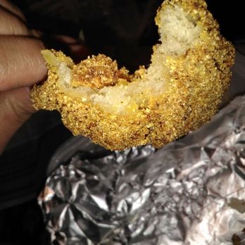 Guthrie's Famous Pizza - a hand holding a fried donut - Pizza Near Me - Guthrie, Oklahoma Guthrie's Famous Pizza - a hand holding a fried donut - Pizza Near Me - Guthrie, Oklahoma