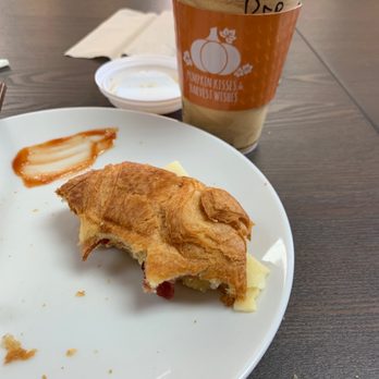 Paddles Coffee - a half eaten croissant sandwich on a plate - Coffee & Tea Near Me - Springfield, Georgia Paddles Coffee - a half eaten croissant sandwich on a plate - Coffee & Tea Near Me - Springfield, Georgia