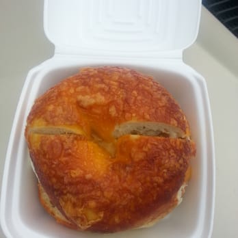 The Bagel Café - Sausage sunrise on cheddar bagel - Bagels Near Me - Katy, Texas The Bagel Café - Sausage sunrise on cheddar bagel - Bagels Near Me - Katy, Texas