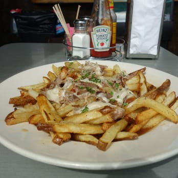 Comet Cafe - Duck Confit Poutine with Fontina Cheese and Beer Gravy - Breakfast & Brunch Near Me - Milwaukee, Wisconsin Comet Cafe - Duck Confit Poutine with Fontina Cheese and Beer Gravy - Breakfast & Brunch Near Me - Milwaukee, Wisconsin