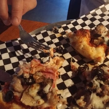 Purdy's Public House - Good ingredients but the pizzas were way undercooked.  That's totally uncooked dough in the middle! - Sports Bars Near Me - Sumner, Washington