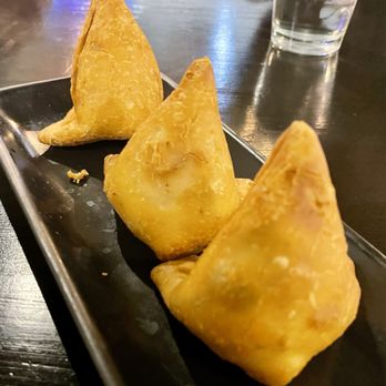 Taz Indian Cuisine - Vegetable Samosa - 3 Pieces, crisp patties stuffed with potatoes, green peas and spices. Served with Mint and Sweet Sauce. - Indian Near Me - Temple, Texas Taz Indian Cuisine - Vegetable Samosa - 3 Pieces, crisp patties stuffed with potatoes, green peas and spices. Served with Mint and Sweet Sauce. - Indian Near Me - Temple, Texas