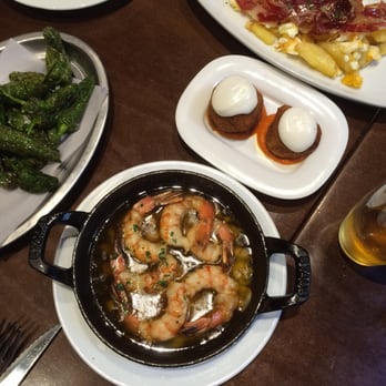 Xaloc - Garlic shrimp, bombas, green peppers, eggs with ham and potatoes. - Tapas Bars Near Me - Barcelona, B