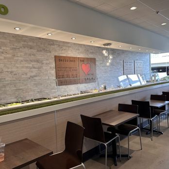 Salata - the interior of a restaurant with tables and chairs - Salad Near Me - Dallas, Texas