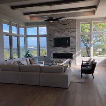Design Select Floors - a living room with large windows - Flooring Near Me - Austin, Texas Design Select Floors - a living room with large windows - Flooring Near Me - Austin, Texas